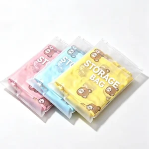 Three frosted EVA plastic ziplock bags in pink blue and yellow featuring cute cartoon bear print and storage text.