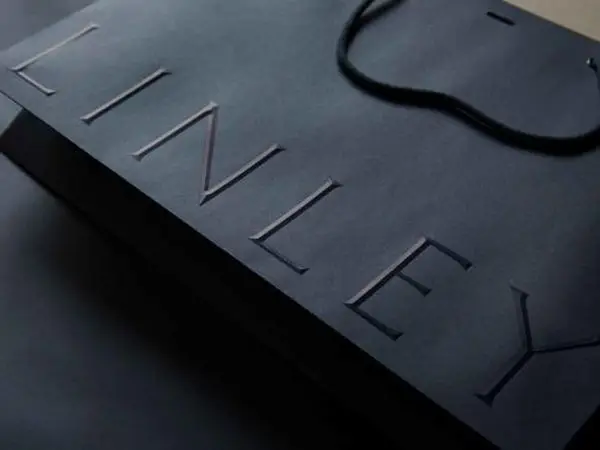 3D embossed tactile logo texture on custom boutique paper bag