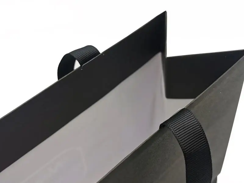 Extra wide side gusset paper shopping bag for bulky retail items
