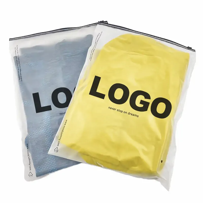 Two frosted plastic zipper bags featuring bold black custom logo prints on yellow and blue garments.