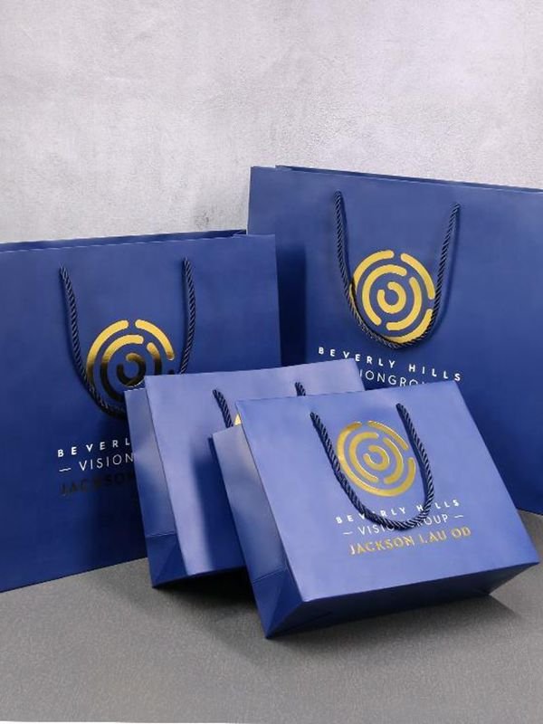 Blue custom printed paper gift bags brand packaging