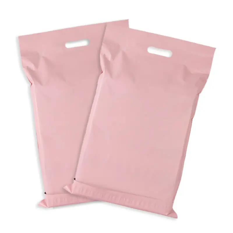 Pair of custom pastel pink poly mailer shipping bags with die-cut carrying handles