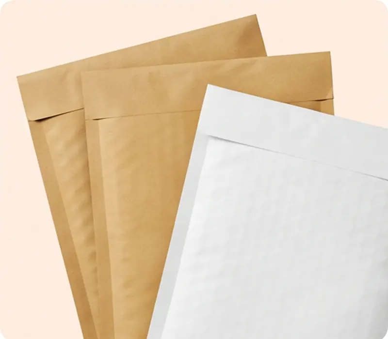 Brown kraft and white kraft padded bubble mailers shown together